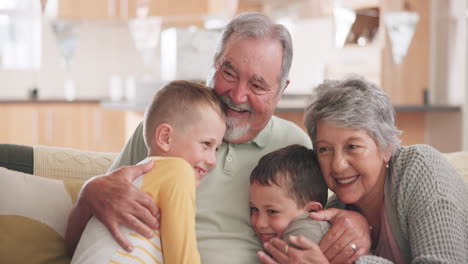 grandparents, family and children hug on sofa