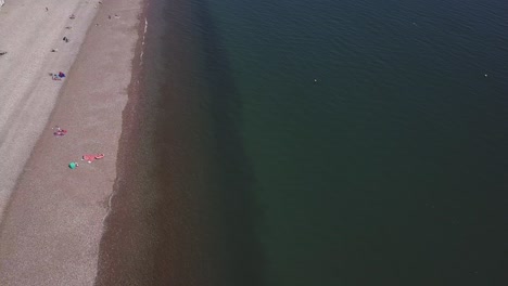 An-aerial-view-of-the-beautiful-pebble-beaches-of-Budleigh-Salterton,-a-small-town-on-the-Jurassic-Coast-in-East-Devon,-England-near-Exeter