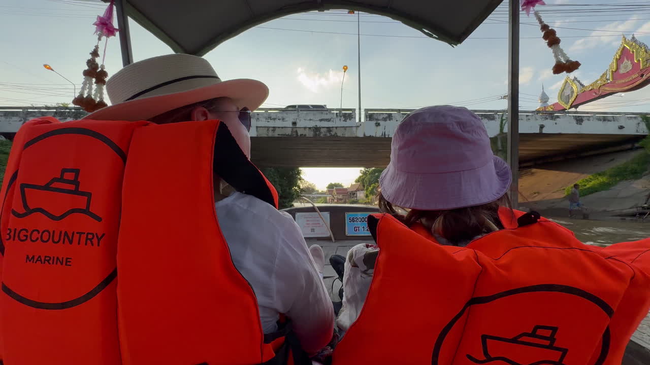 Boat Tour Through a Thai Canal Under a Bridge