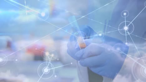 animation of network of connections over hands in protective gloves holding laboratory sample