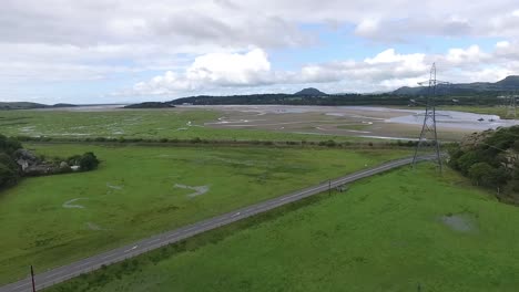 Drone-flight-over-water-"Veins"-on-a-beach-in-North-Wales,-England