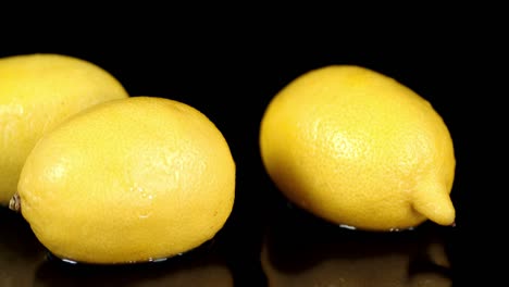 fresh ripe lemons roll in the water.