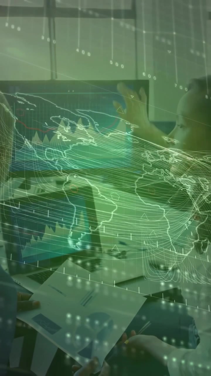 Screen alert causing team leaning in sharing reports and checking business charts with hologram map