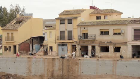 Volunteers removing mud from a house in flood-hit Rambla del Poyo, Valencia