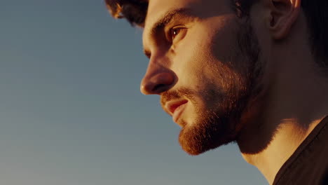 man watching a horse run at sunset