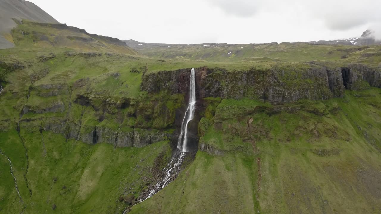 Icelandic Waterfall in a Mountain Valley