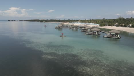 quaint tourist huts in shallow bay of little stirrup cay in bahamas