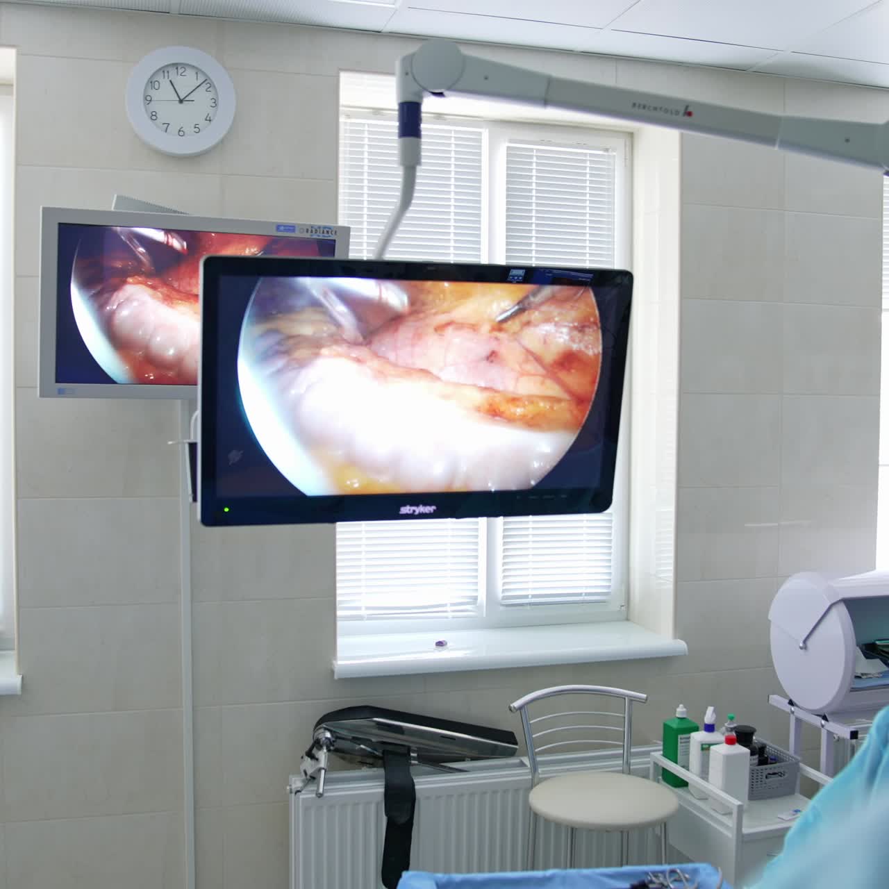 Treatment of proctological diseases. Group of surgeons in operating room with surgery equipment