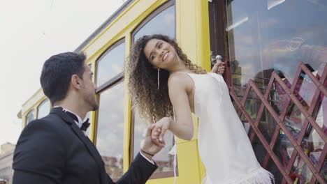 romantic proposal on a yellow tram