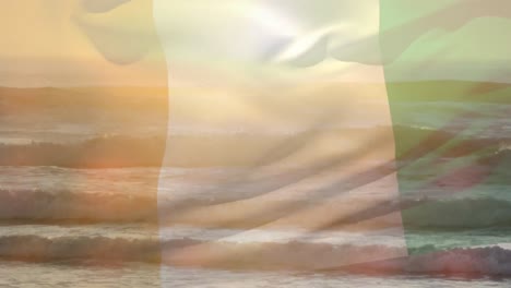 Digitale-Komposition-Der-Wehenden-Flagge-Der-Elfenbeinküste-Vor-Der-Luftaufnahme-Des-Strandes-Und-Der-Meereswellen