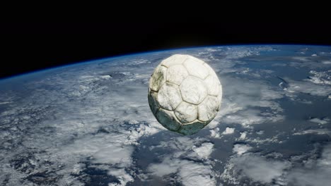 old soccer ball in space on earth orbit