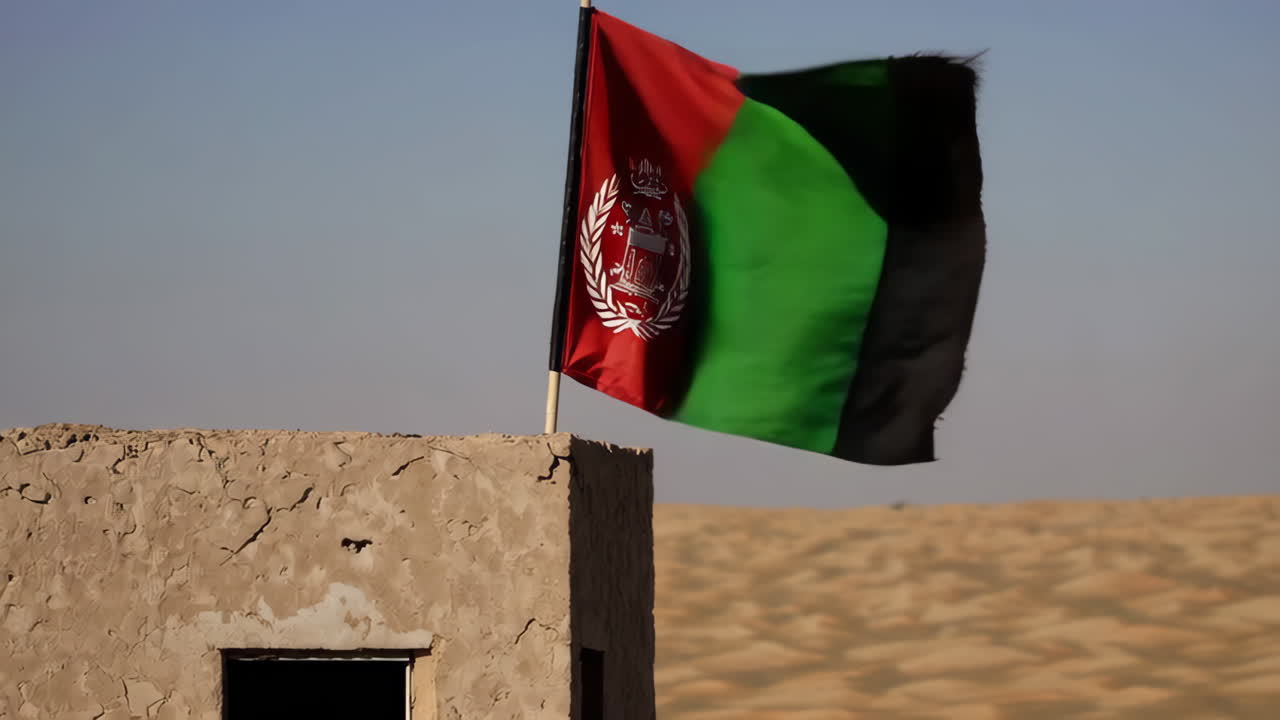 Afghan Flag Flying Over a Desert Structure