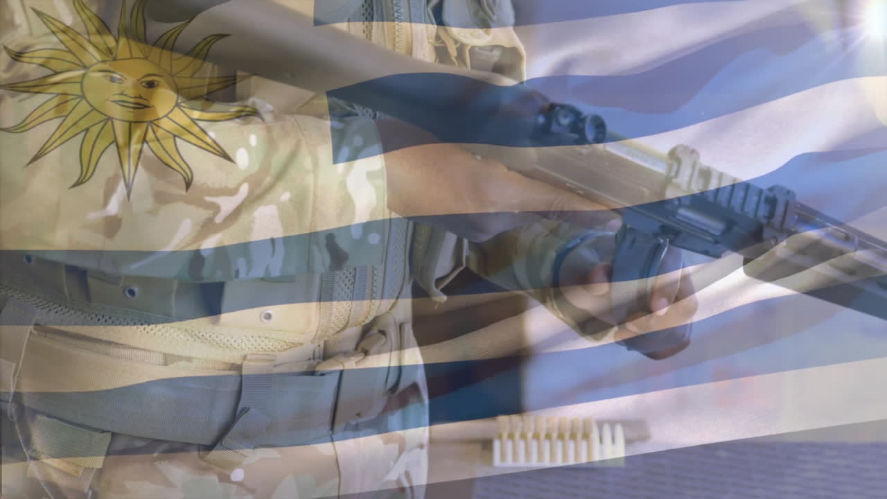 Animation of flag of uruguay over african american soldier holding gun
