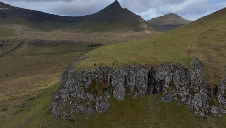 hvithamar-viewpoint,-Faroe-Islands:-aerial-view-traveling-out-to-the-viewpoint-where-you-can-see-the-famous-Funningsfjorour-fjord