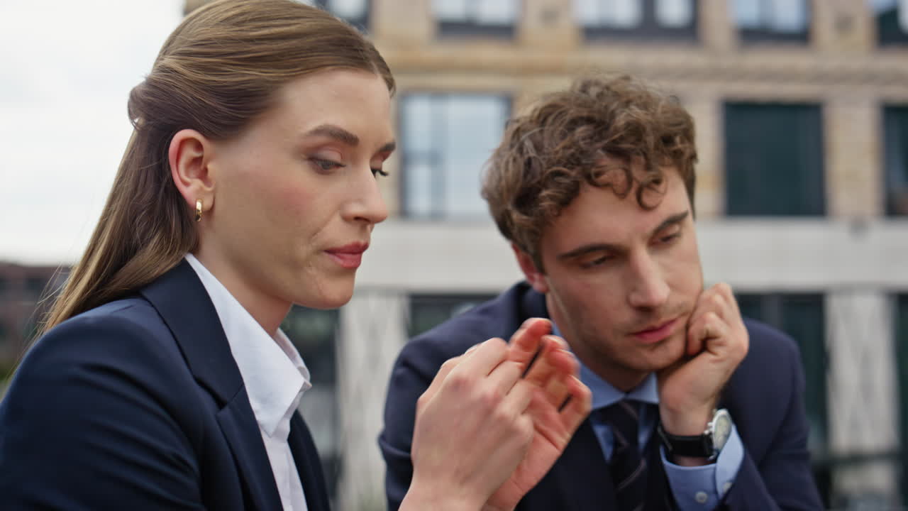 Professional coworkers discussing strategy project at outdoors terrace closeup