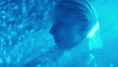 extraterrestrial woman walking through projection of laser light
