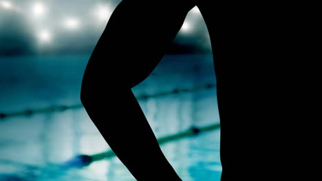 animation of midsection of male swimmer over spotlights and swimming pool