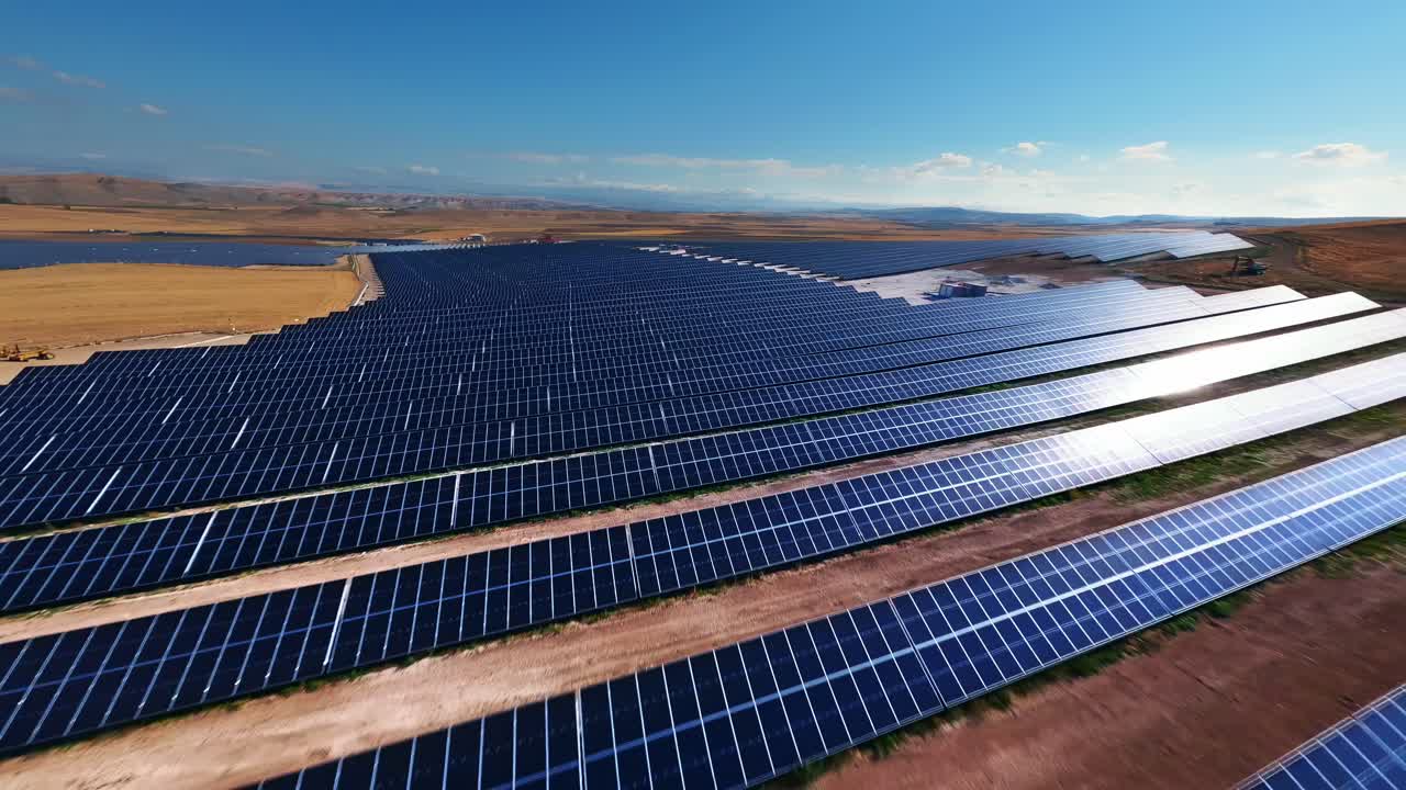 Soaring above endless rows of solar panels with an FPV drone, capturing the power and potential of renewable energy from a unique perspective