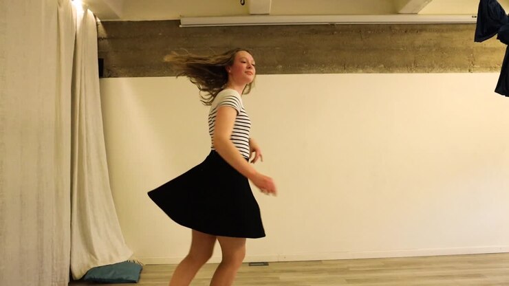 Teenage female dancer spinning around