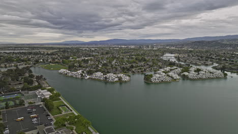 foster city california aerial v4 birds eye view flyover residential neighborhood around central lake capturing waterfront apartments complex an overcast cloudy day - shot with mavic 3 cine - june 2022