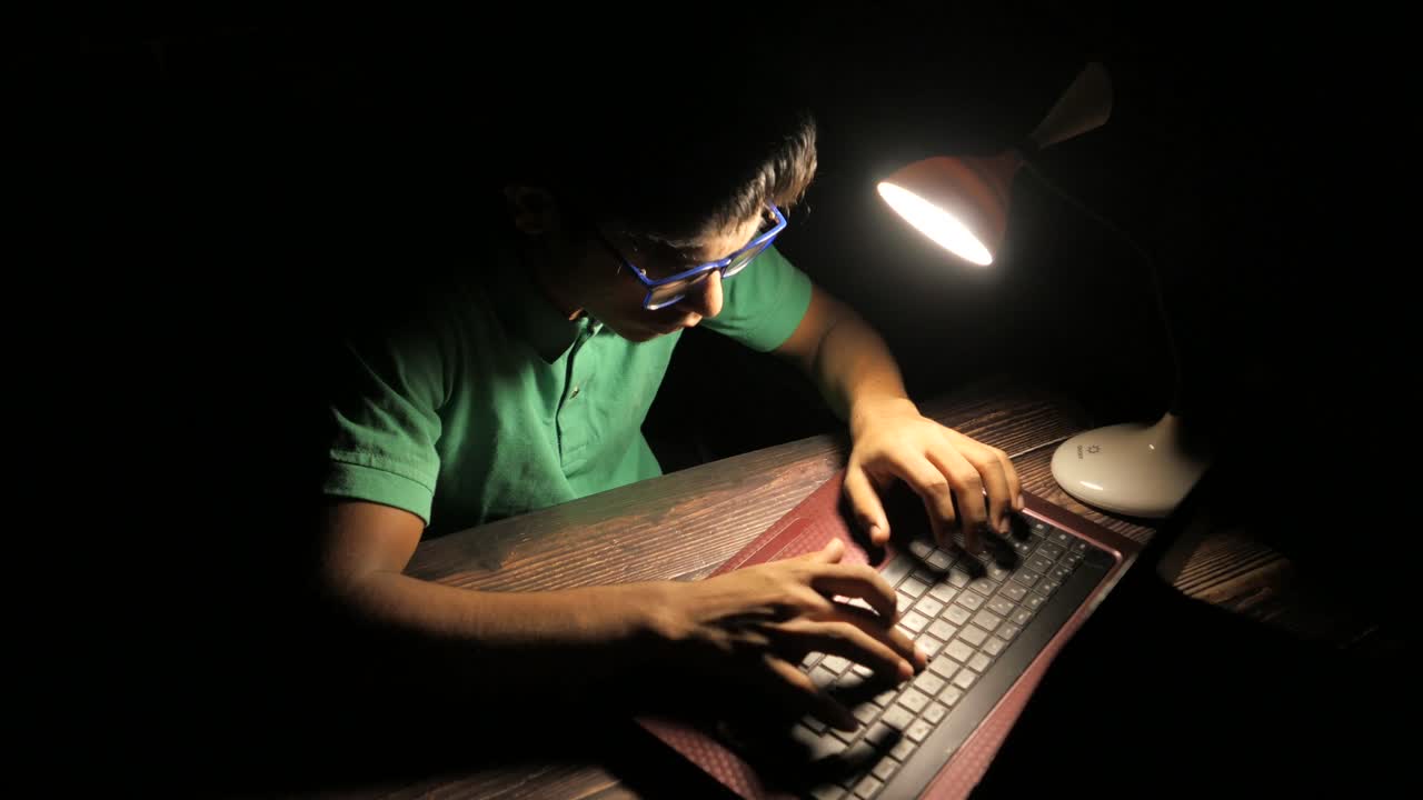 Teenager Studying Late at Night