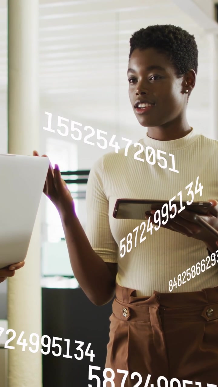 Vertical video: Host starting tech demo with tablet, gesturing as AR numbers scrolling over host