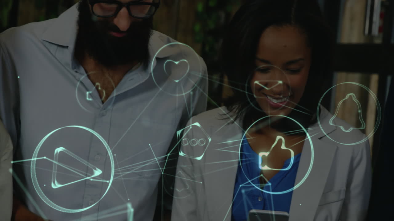 Network of connection icons against office colleagues using electronic devices
