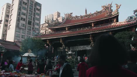 time-lapse shot of people make merit in chinese lunar new year's eve at longshan temple