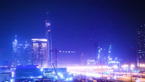 dubai cityscape at night with construction