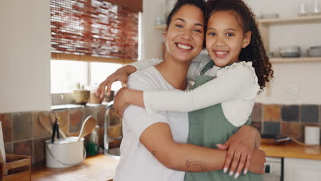 Love,-mother-and-girl-hug-in-house-kitchen