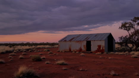 rusty shed in the australian outback at sunset or sunrise