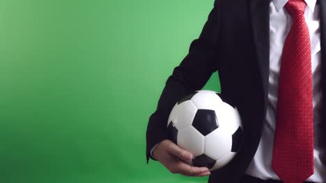 football manager holding soccer ball, video in 4k