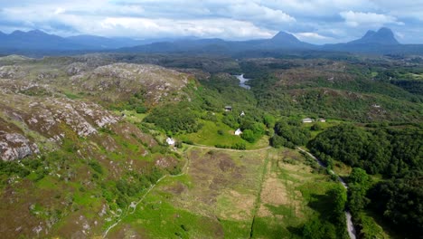 remote road in scotland - mountain backdrop