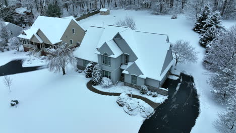 pullback reveal of upscale single family homes real estate in winter snow