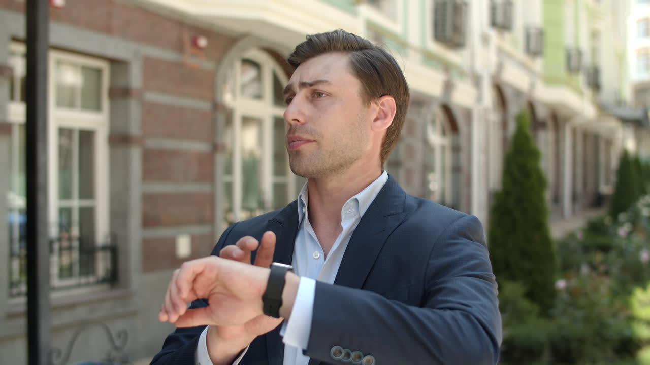 Closeup businessman checking time. Businessman waiting for appointment at street