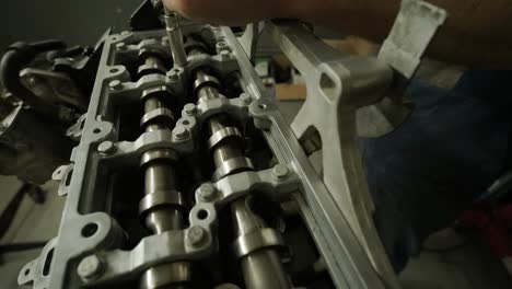 open car engine close-up. an auto mechanic in a garage repairing a car engine after removing a cover. car engine repair. car service