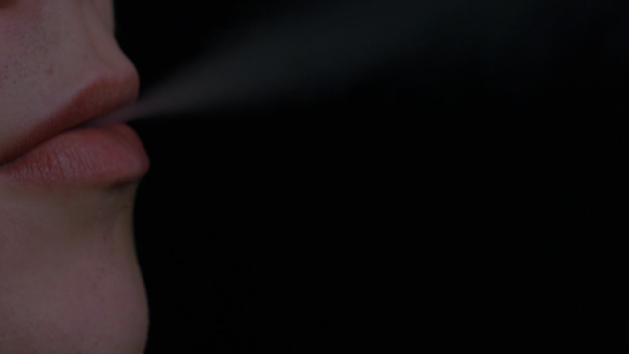Person Exhaling