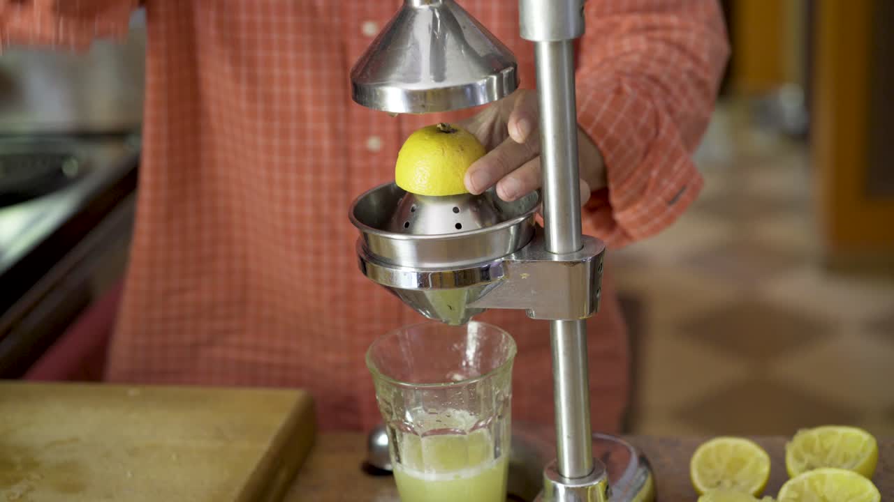 Squeezing lemons using a juicer
