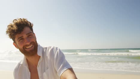 Couple-having-fun-at-beach-on-a-sunny-day-4k