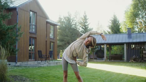 woman stretching outdoors in backyard