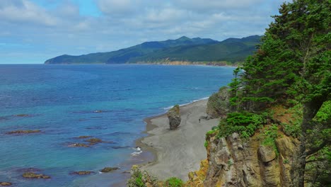 coastal scenery with rocky beach and mountains