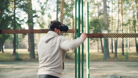 man using vr headset for boxing training outdoors