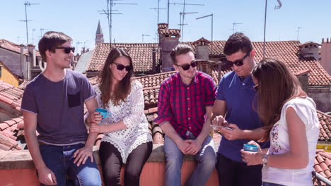 friends enjoying a rooftop view in venice