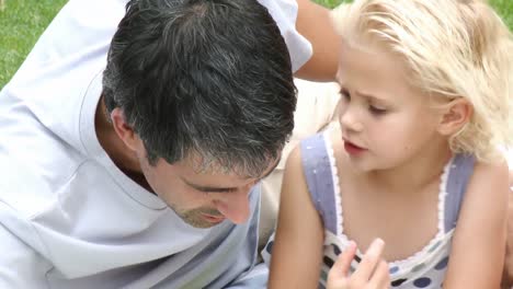 father with his daughter in the garden