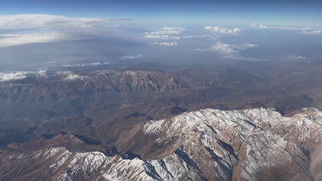 aerial view of mountain range with snow