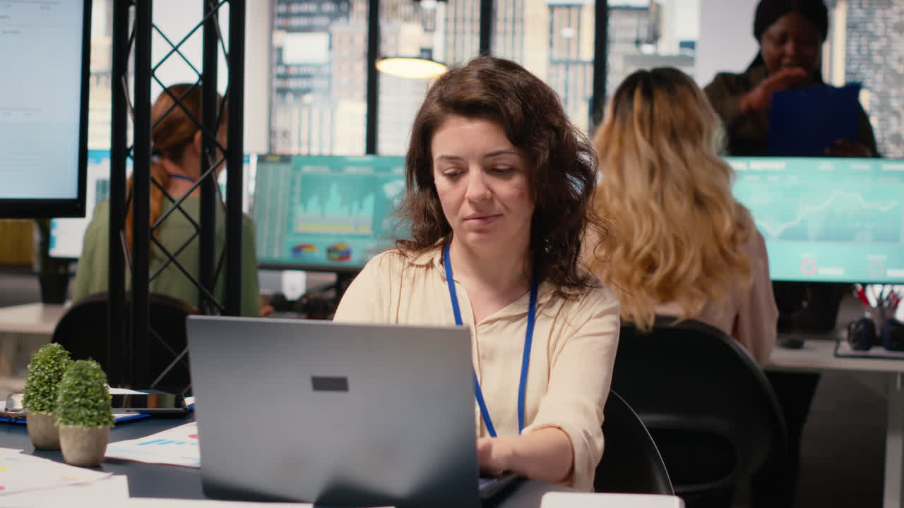 Vertical Video Focused administrator immersed in data analysis and strategic planning