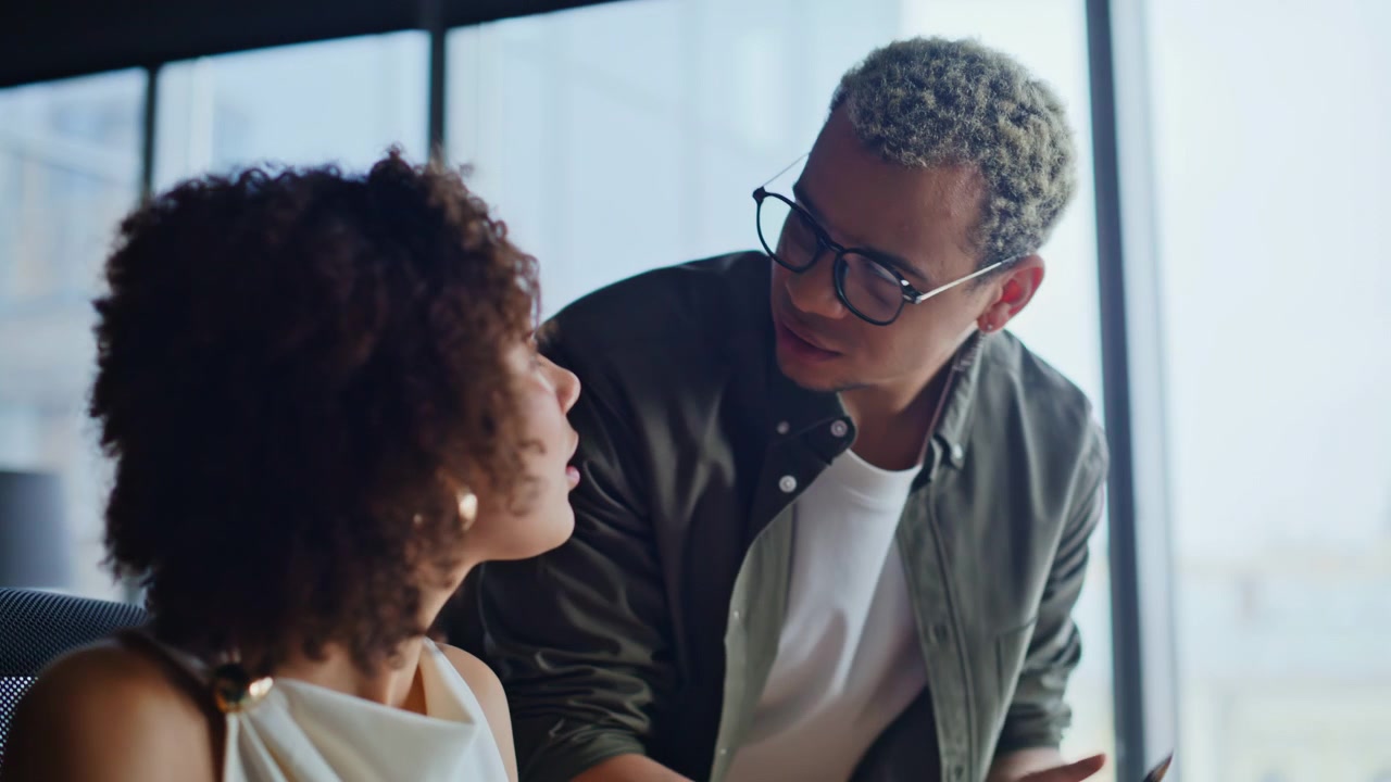 Businesswoman reviewing paperwork colleague office. Closeup team discuss project