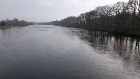 revealing shot of the new destiny bridge over river tay in perth, scotland.