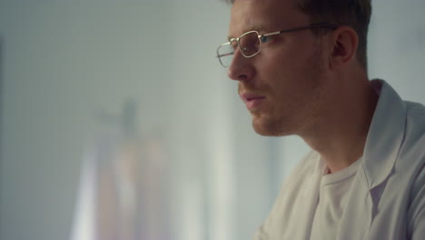 Focused-physician-working-computer-in-hospital-close-up.-Portrait-serious-doctor