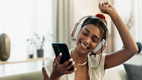 Woman,-phone-and-headphones-for-dance-on-sofa